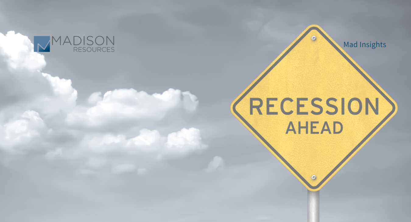A sign pointing to a recession