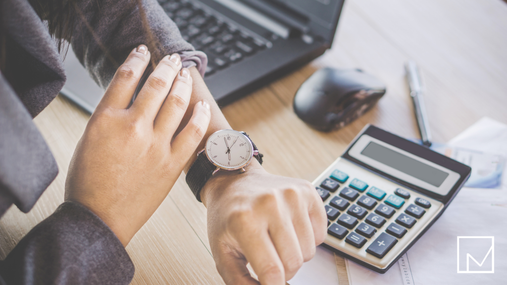 Staffing professional checking time on wristwatch, symbolizing time management and productivity.