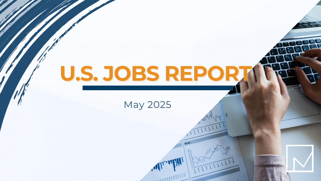 Person typing on a laptop next to printed reports and charts, illustrating analysis of the U.S. Jobs Report for May 2025.