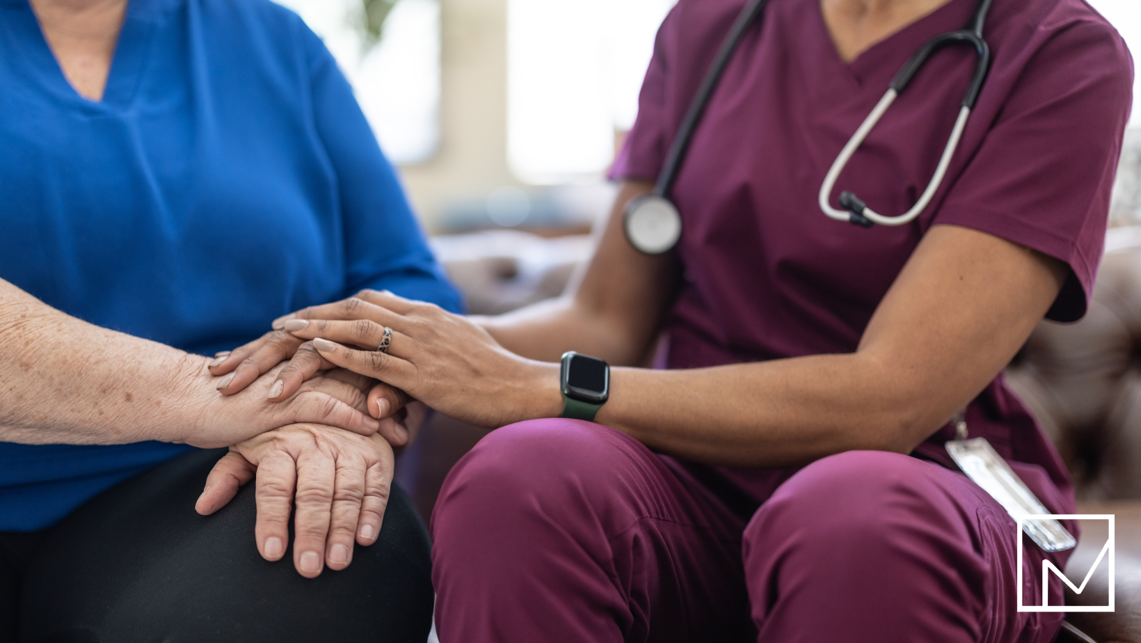 Nurse holding patient’s hands, symbolizing compassionate healthcare staffing supported by reliable payroll funding