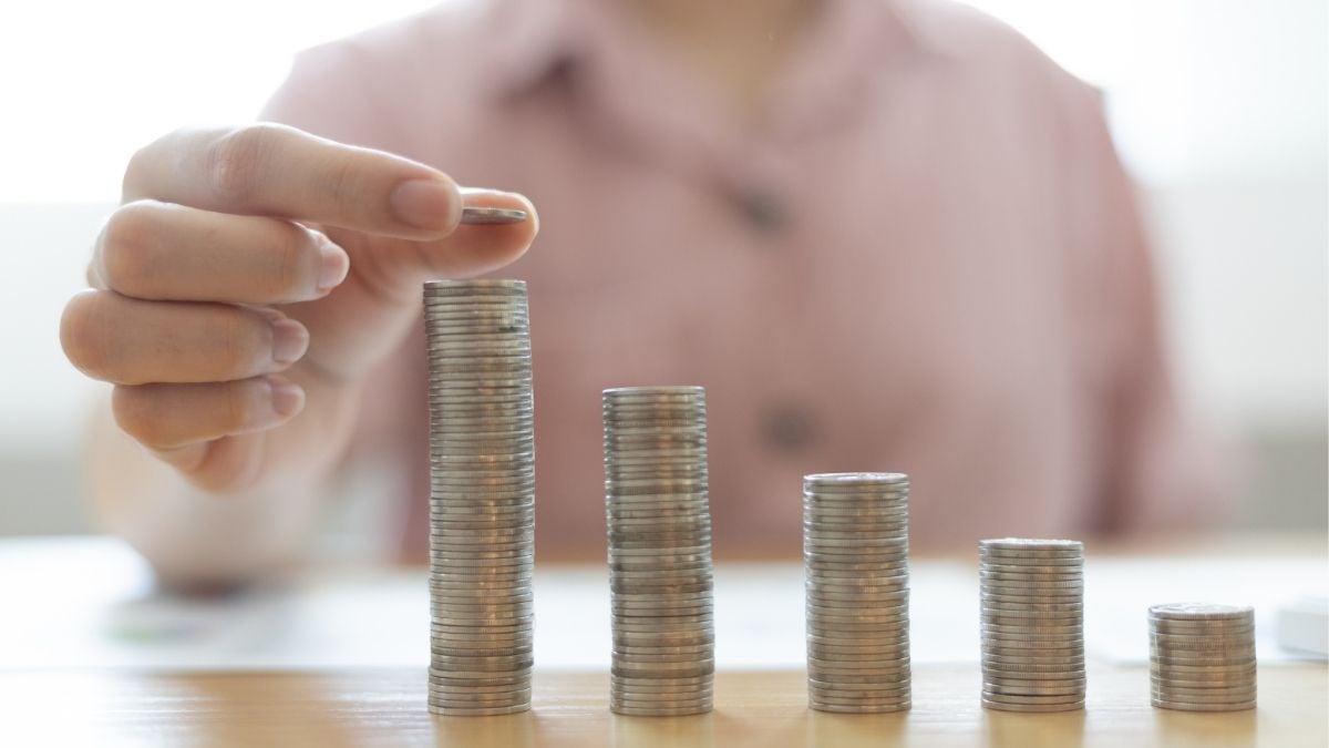 Stacking coins to represent revenue growth and increased agency value through contract staffing.