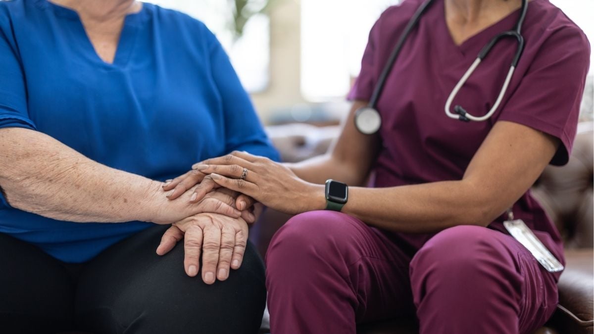 Healthcare professional supporting patient representing stability and growth for healthcare staffing agencies with payroll funding.