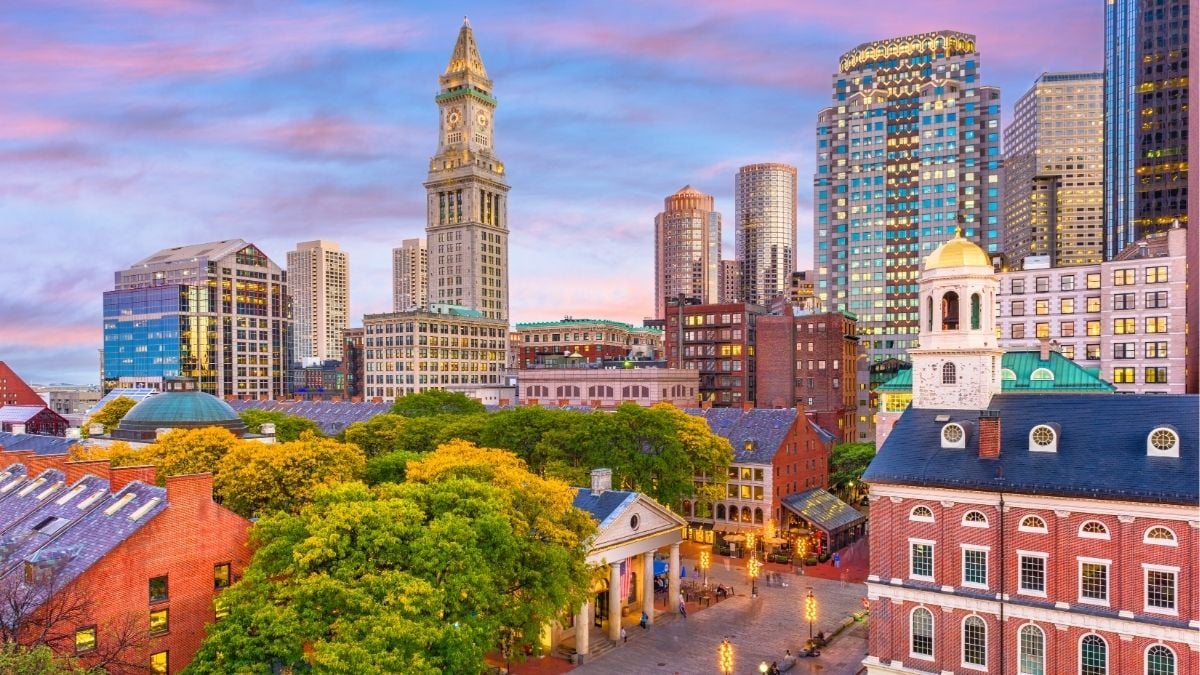 Boston skyline at sunset representing payroll funding and back office support for staffing firms in Boston.