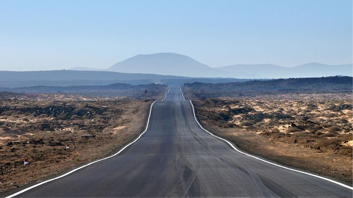 Long open road stretching into the distance representing the 50-mile rule and travel-related tax advantage in staffing.