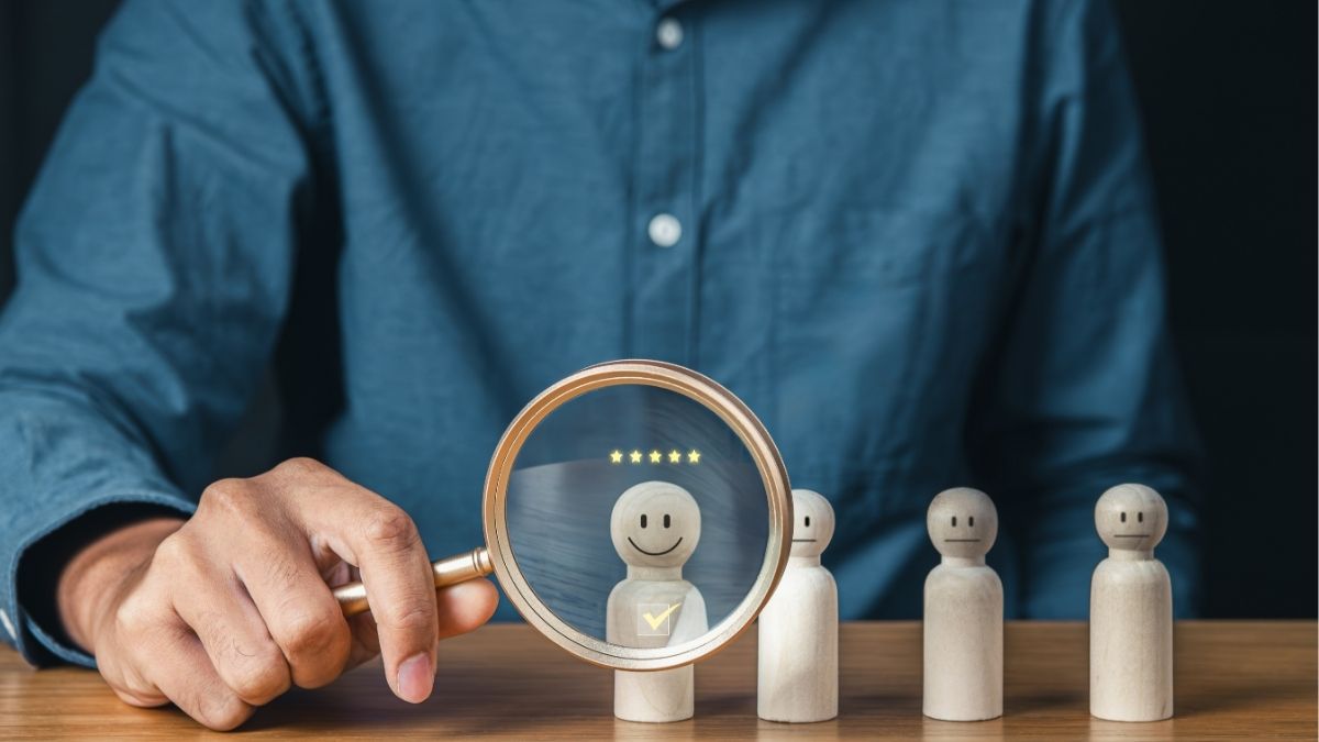 Small business owner evaluating candidates and selecting top employee using proven hiring strategies.