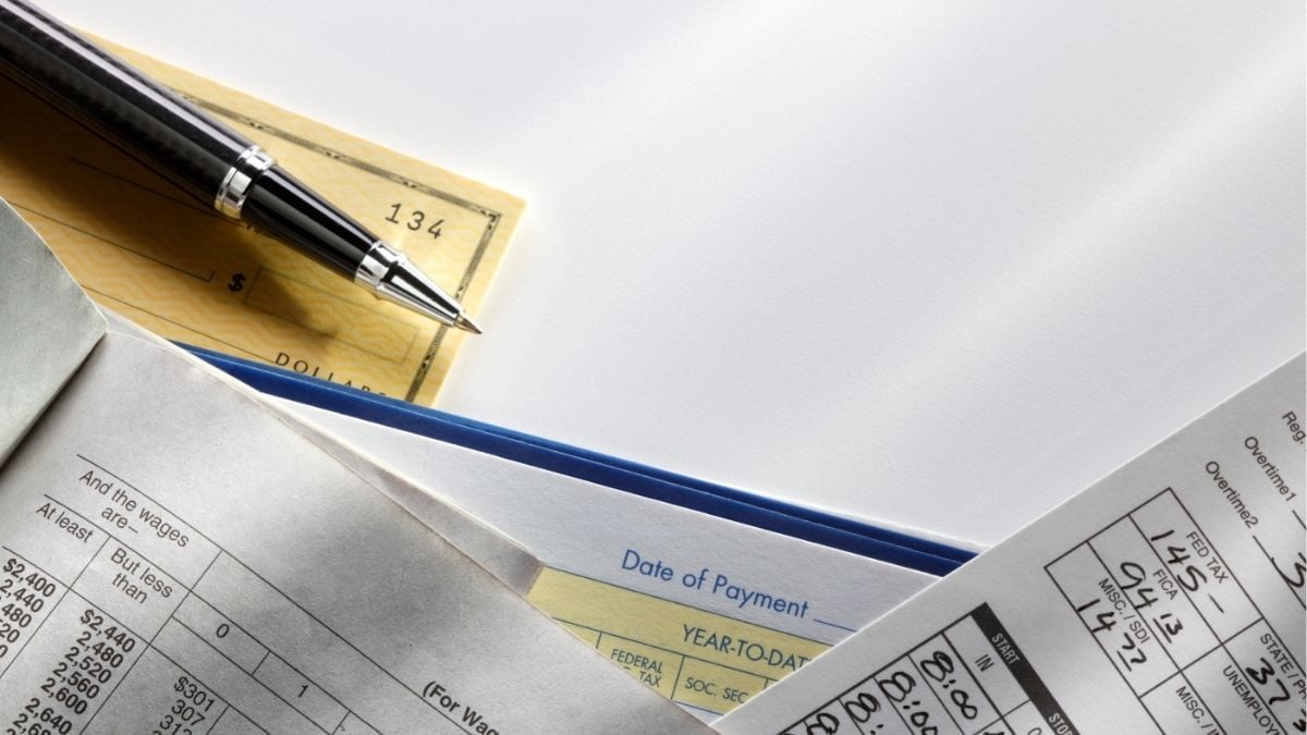 Payroll checks, tax documents, and payment records representing payrolling for staffing firms.