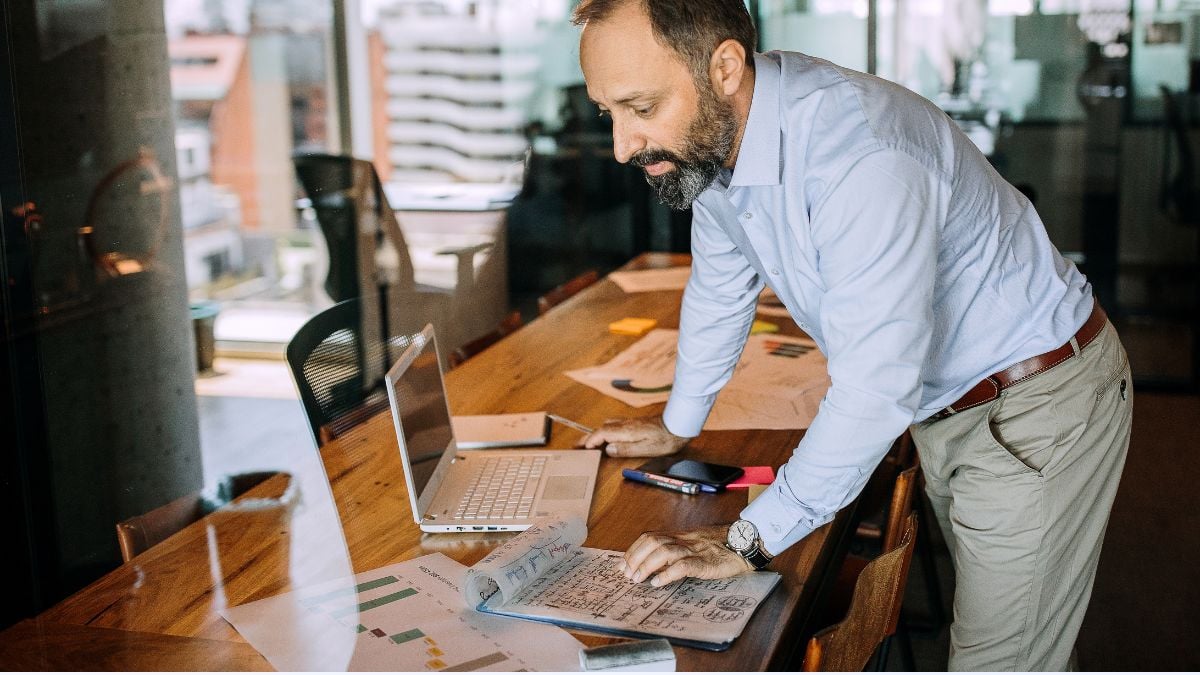 Staffing leader focused on work at desk demonstrating productivity without multitasking.