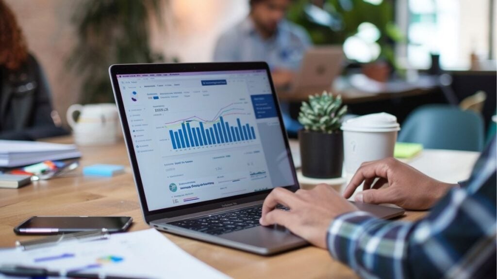 Professional using analytics dashboard on laptop, representing flexible staffing software solutions and system integration to support different workflows.
