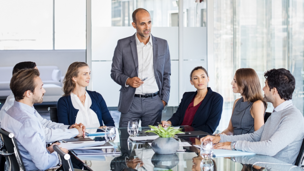 Business team meeting in office, representing staffing solutions including payroll funding and back office support to help firms grow and operate efficiently.