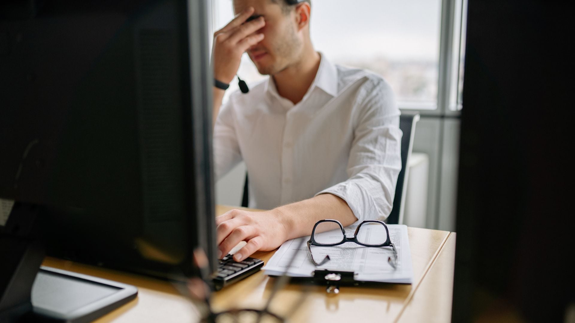 businessman frustrated because his staffing back office is holding his firm back.