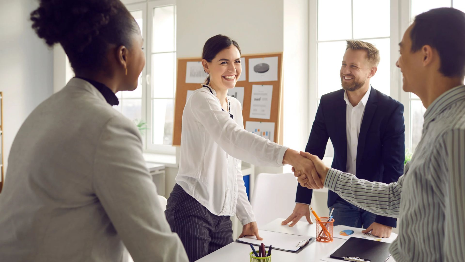 Staffing firm leaders shaking hands, reflecting what makes a staffing firm successful